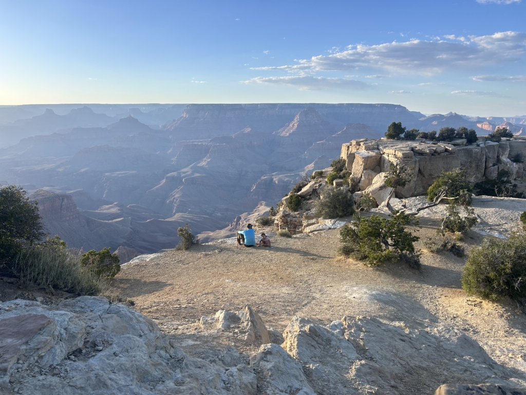 Orlando and Sophia deep in thought at the scenic outlook at Moran Point